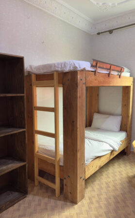 bunk bed with the storage for the dorm room in cactus surf experience imsouane