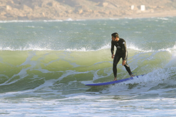 surfing green wave on lesson in the bay imsouane